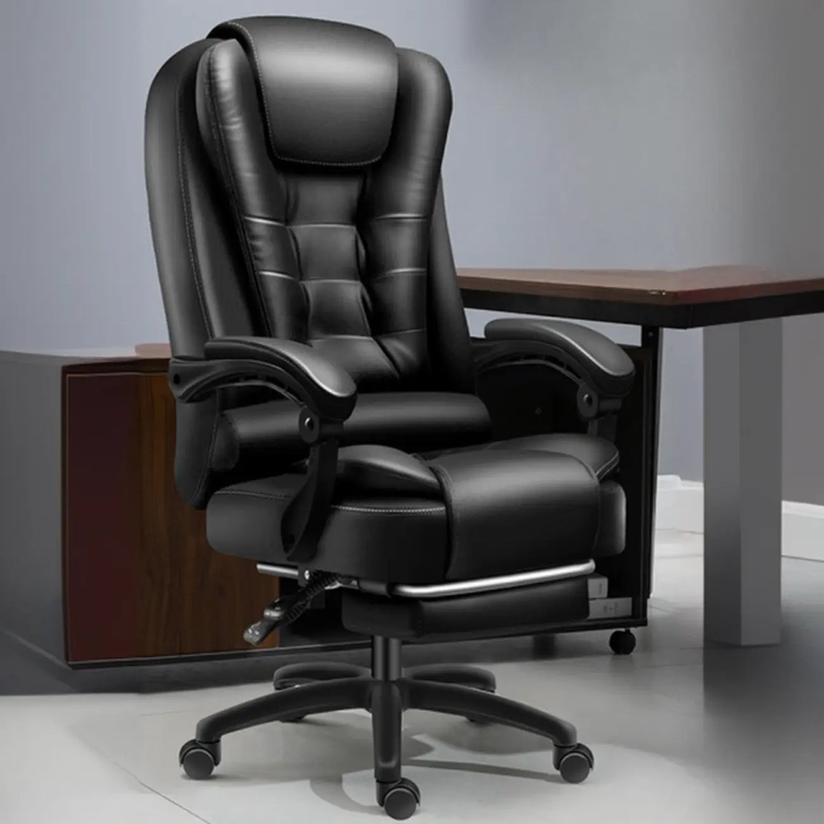 Ergonomic Black Leather Swivel Office Chair with Footrest